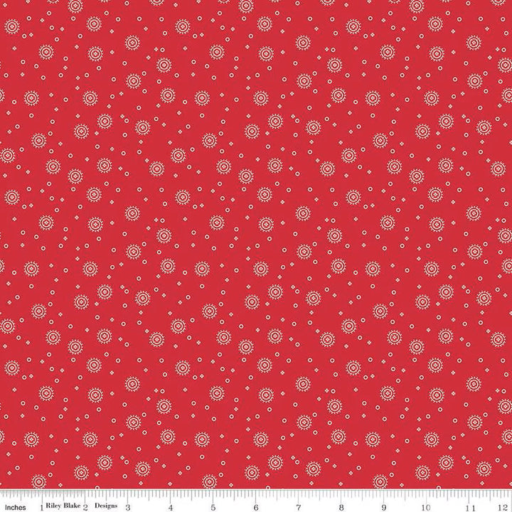 Red Delicious - Cherry Soda Red puuvillakangas, valkoisia täpliä punaisella taustalla.