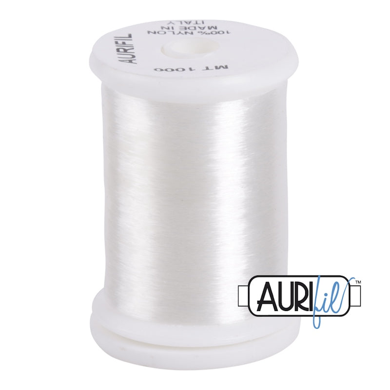 Aurifil Monofilament Clear – läpinäkyvä ompelulanka 100 % nylonista, huomaamattomaan tikkaamiseen ja applikointiin.