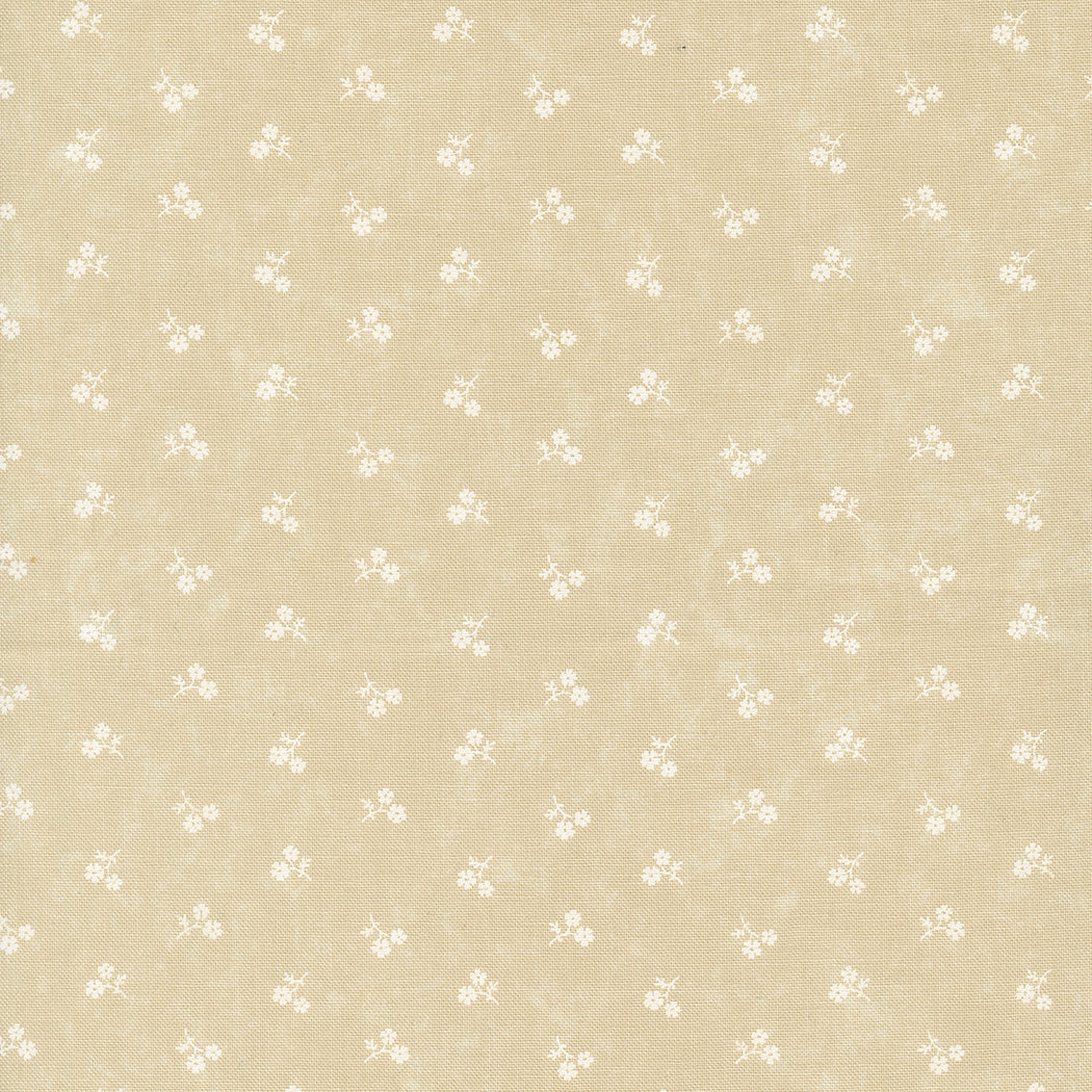Kansas Troubles Quilters - Blackbird's Nest Petie Petals Tan Tonal puuvillakangas, jossa valkoisia pieniä kukkakuvioita beigen pohjalla.