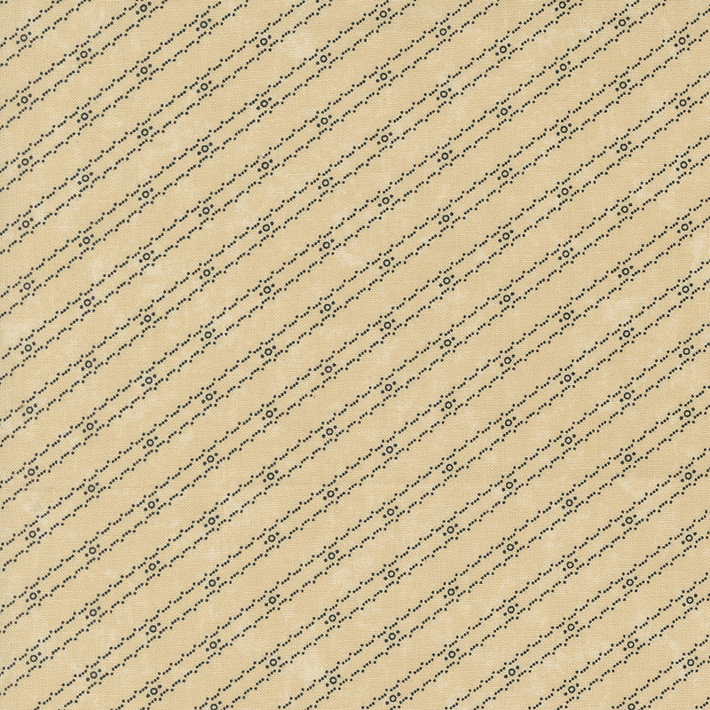 Kansas Troubles Quilters - Blackbird's Nest Bird Tracks Tan puuvillakangas, jossa mustia geometrisia raitakuvioita beigen pohjalla.