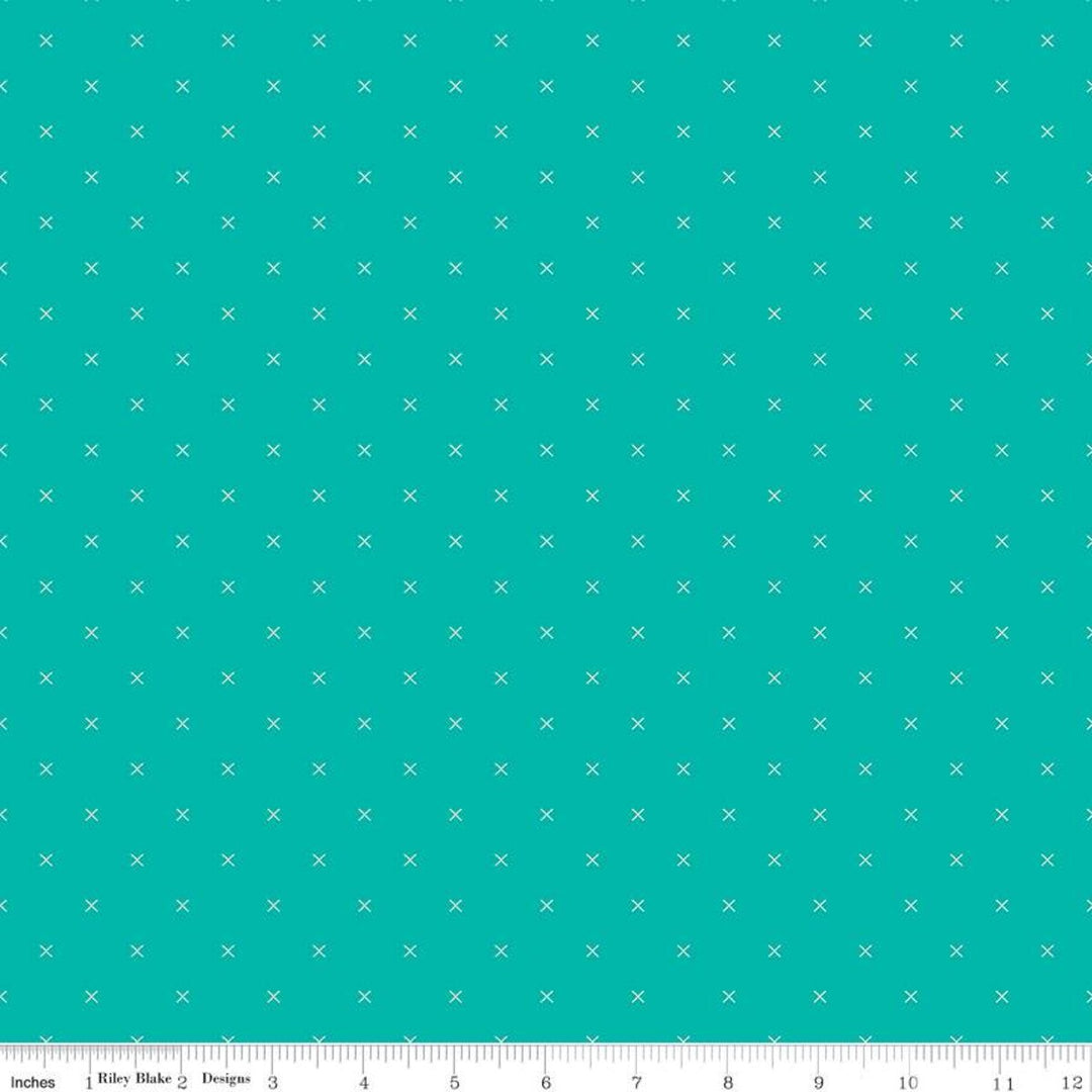Vihreä puuvillakangas, jossa valkoisia X-muotoisia pisteitä Lori Holtin Bee Cross Stitch-kokoelmasta, ihanteellinen tilkkutöihin ja ompeluprojekteihin