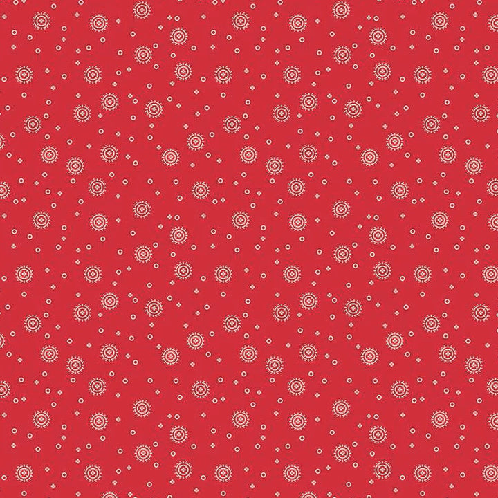 Red Delicious - Cherry Soda Red puuvillakangas, valkoisia täpliä punaisella taustalla.