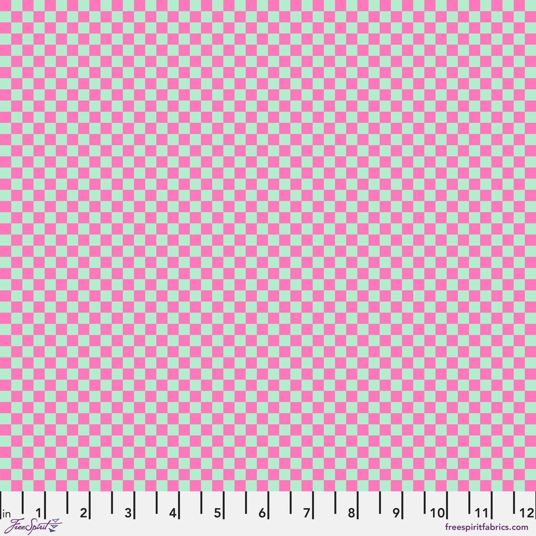 Check Please Cosmic: Tula Pinkin Untamed -kokoelman puuvillakangas neonkorostuksilla ja geometrisilla kuvioilla.