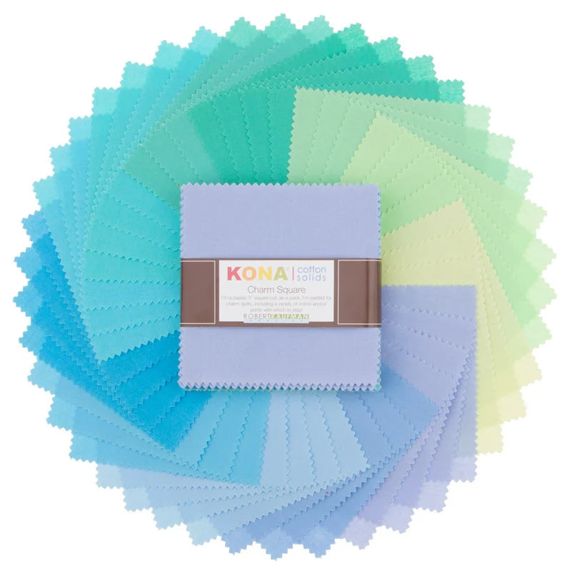 Kona Cotton Solids Mermaid Shores Charm Pack – 42 turkoosin, vihreän ja laventelin sävyn neliötä viuhkamuodostelmassa, Robert Kaufman