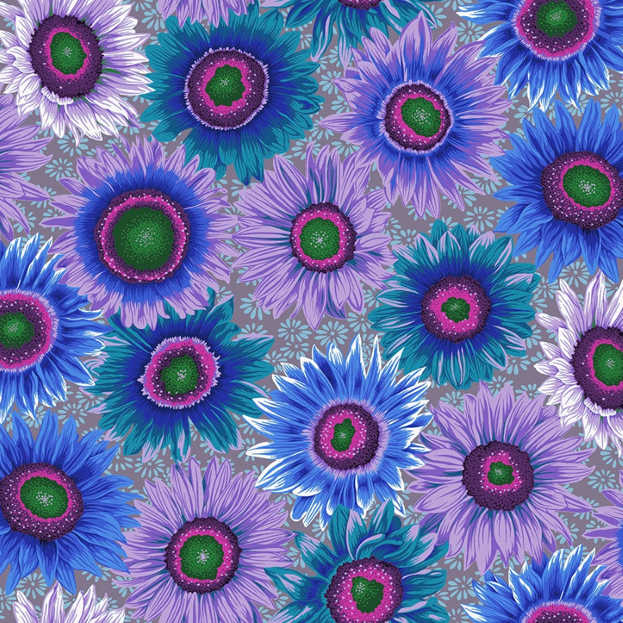 Kaffe Fassett Van Gogh Blue -puuvillakangas, jossa suuret värikkäät auringonkukat mustalla taustalla — lilan, sinisen ja valkoisen sävyissä.