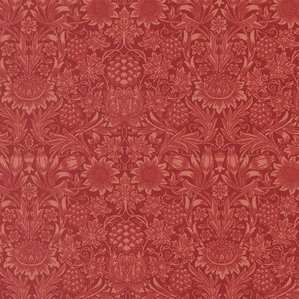 Barbara Brackmanin Morris Muse -kokoelman 13386-16 Sunflower Damask Russet -puuvillakangas – klassinen William Morris -kuosi, jossa  kukkia ja lehtikuvioita punaisella pohjalla.