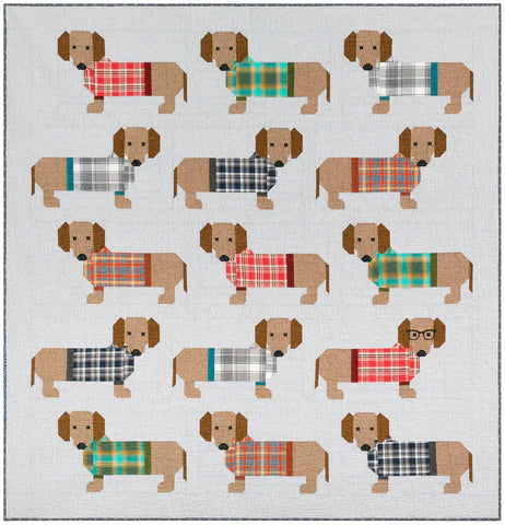 Tilkkutyöpeitto, jossa 16 mäyräkoiraa värikkäissä ruutupuseroissa. Malli: Dog in Sweaters – suunnittelija Elizabeth Hartman. Valmis koko n. 185 × 193 cm.