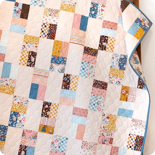 Elena Amo Blossoms and Blooms kokoelman tilkkupeitto.