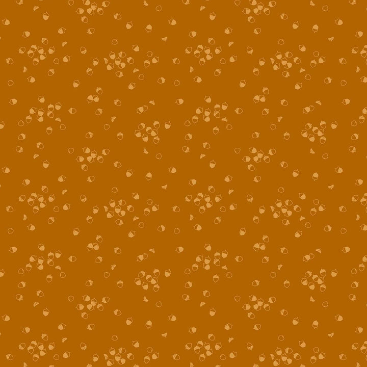 Vaaleanruskeapohjainen puuvillakangas, jossa pieniä tammenterhokuvioita. Ghazal Razavin suunnittelema Lucky Charms -kokoelman Acorn Rust -kangas Figo Fabricsilta.