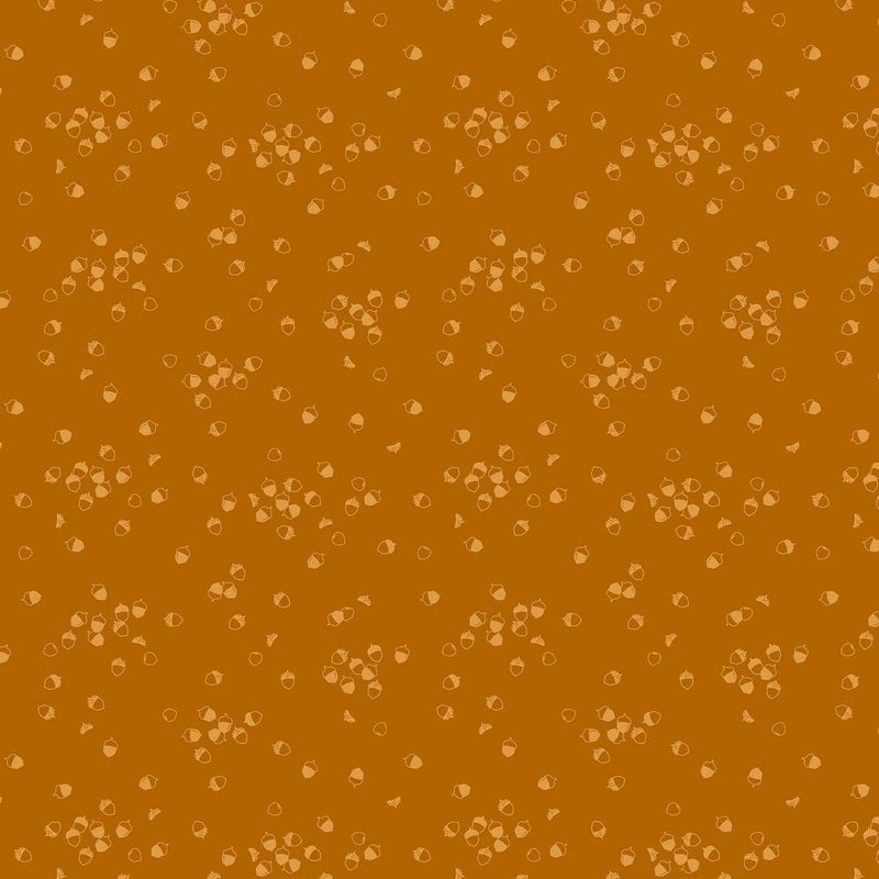 Vaaleanruskeapohjainen puuvillakangas, jossa pieniä tammenterhokuvioita. Ghazal Razavin suunnittelema Lucky Charms -kokoelman Acorn Rust -kangas Figo Fabricsilta.