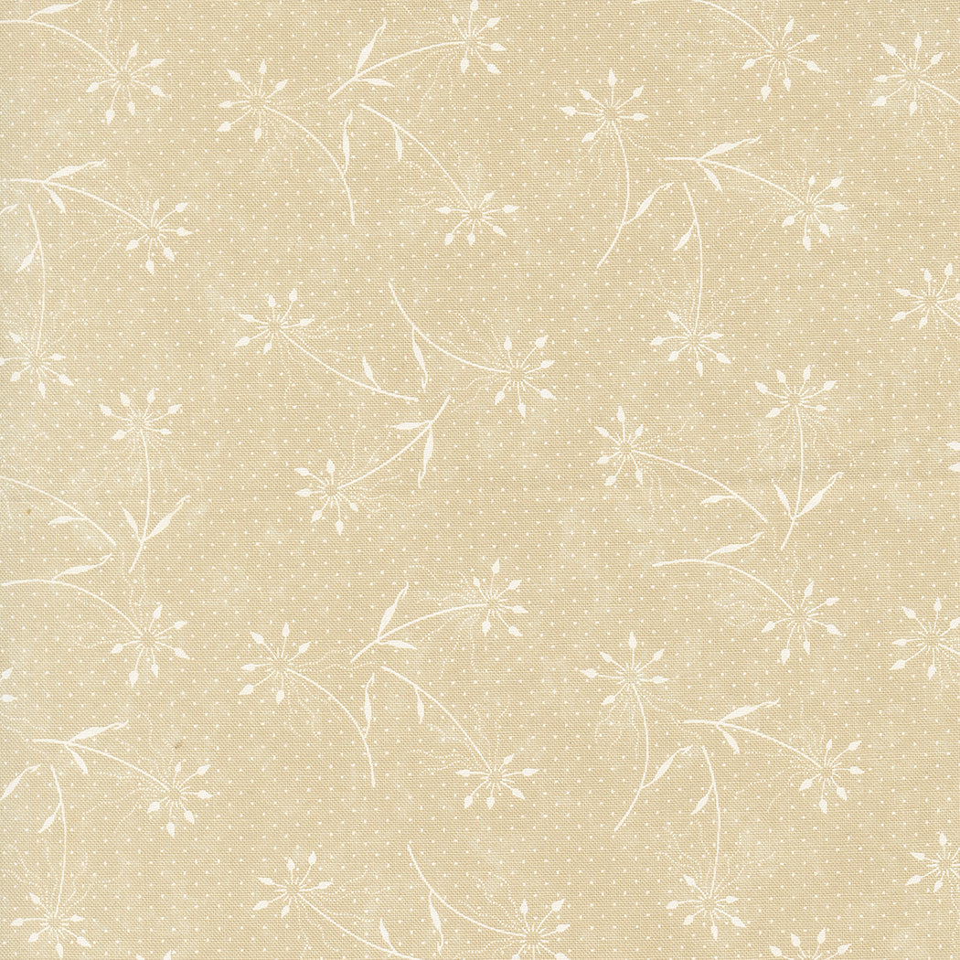 Kansas Troubles Quilters - Blackbird's Nest Dandelions Tan Tonal puuvillakangas, jossa valkoisia voikukkakuvioita ja pieniä pilkkuja lämpimän beigen pohjalla.