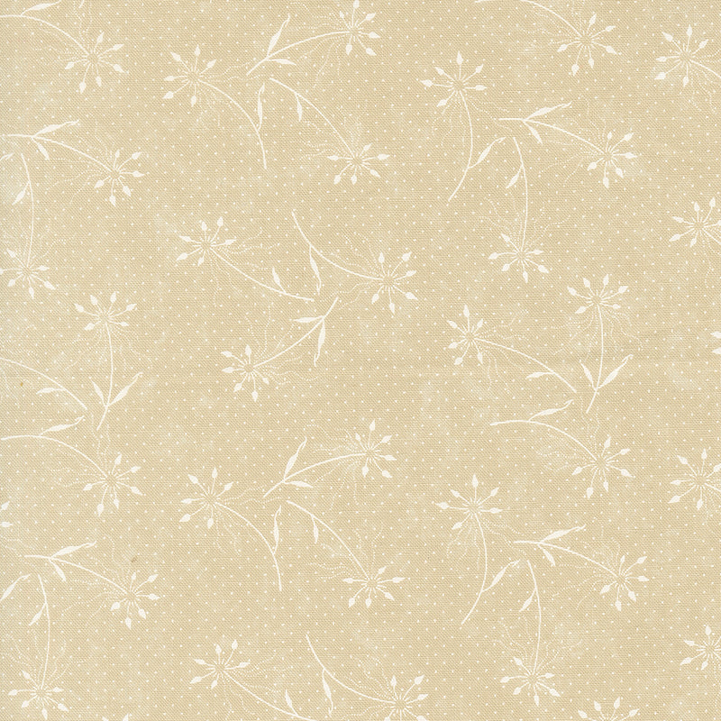 Kansas Troubles Quilters - Blackbird's Nest Dandelions Tan Tonal puuvillakangas, jossa valkoisia voikukkakuvioita ja pieniä pilkkuja lämpimän beigen pohjalla.