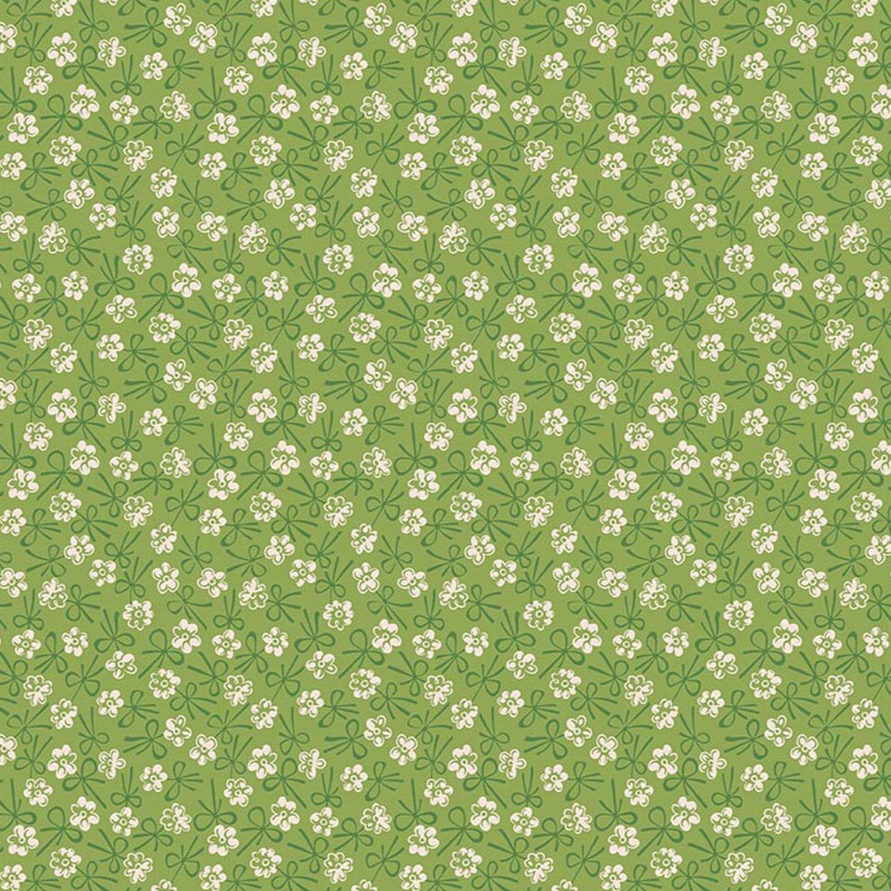 Lori Holtin Farmer's Daughter -kokoelman Bonnet Thyme -puuvillakangas. Viheä pohja, geometrisiä kukkakuvioita, sopii tilkkutöihin ja käsitöihin.