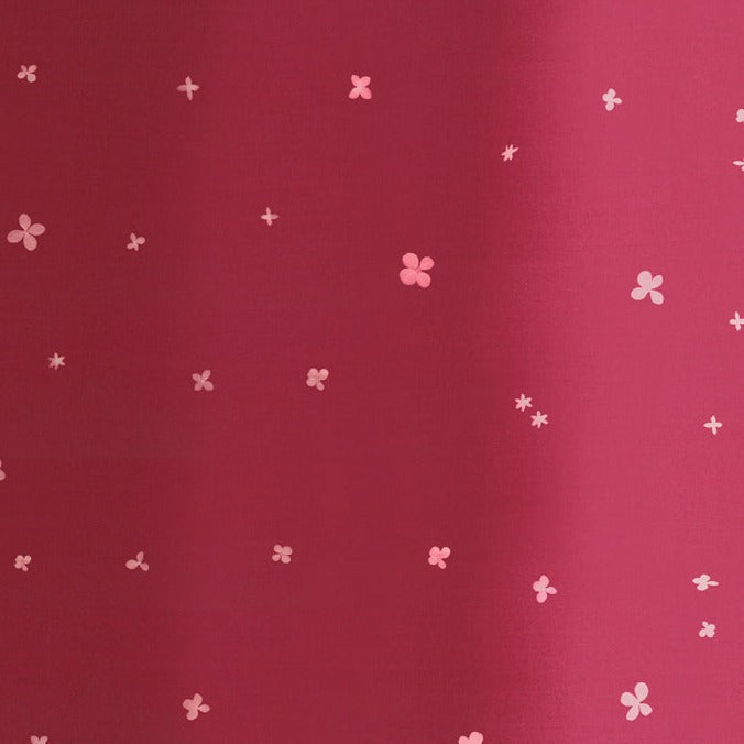 V&Co Ombre Bloom Burgundy 10870-317, tummanpunainen liukuvärinen puuvillakangas kukka- ja tähtikuvioinnilla
