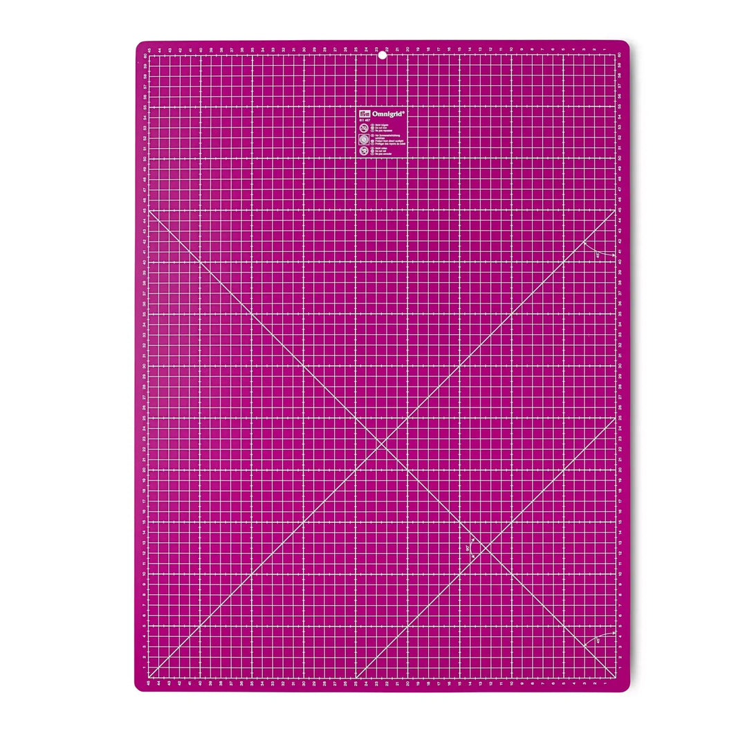 Prym Omnigrid leikkuualusta 60×45 cm magenta – suuri itsekorjautuva leikkuualusta sentti- ja tuumamitoilla tilkkuiluun ja ompeluun.