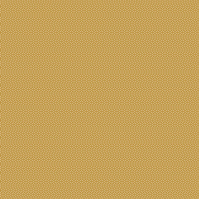 Tilda Poppy Seed Honey 130176 – keltainen puuvillakangas, jossa pieniä vaaleita pilkkuja.