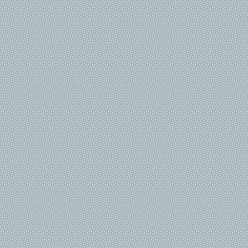 Tilda Poppy Seed Soft Blue 130181 – vaaleansininen puuvillakangas, jossa pieniä vaaleita pilkkuja.