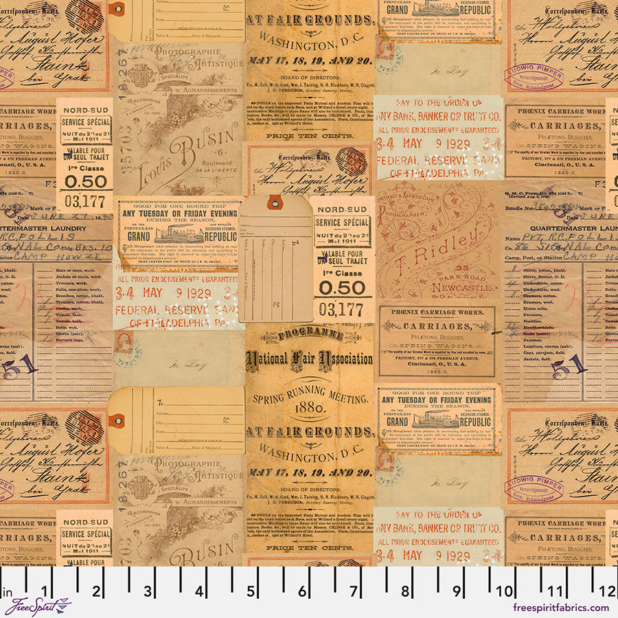 Tim Holtz Eclectic Elements/Palette Orange Ephemera puuvillakangas, jossa vintage-tyylisiä ephemera-kuvioita ja lämpimät oranssit ja ruskeat sävyt.