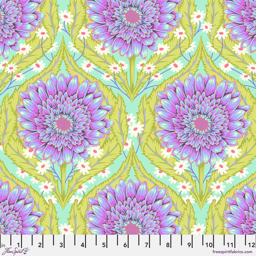 Daisy and Confused Nova: Tula Pinkin Untamed -kokoelman kukkakuvioinen puuvillakangas neonkorostuksilla ja geometrisilla kuvioilla.