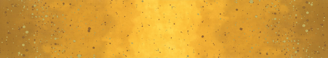 Lähikuva V&Co Ombre Galaxy Metallic Mustard 10873-213M -puuvillakankaasta, jossa on metallinhohto ja liukuvärjäys.